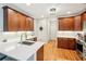 Well-lit kitchen featuring quartz counters, stainless steel appliances, custom cabinets, and hardwood floors, perfect for everyday cooking at 1228 Dunwoody Walk, Atlanta, GA 30338