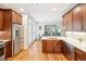 Updated kitchen showcasing stainless steel appliances, custom cabinets, and quartz counters, ideal for culinary adventures and entertaining at 1228 Dunwoody Walk, Atlanta, GA 30338