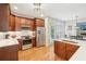 Updated kitchen with stainless steel appliances, custom cabinets, quartz counters, and hardwood floors offering a great cooking space at 1228 Dunwoody Walk, Atlanta, GA 30338