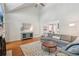 Spacious living room with high ceilings, hardwood floors, and a comfortable sectional sofa at 1228 Dunwoody Walk, Atlanta, GA 30338