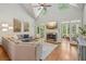 Open living room with vaulted ceilings, fireplace, hardwood floors, and comfortable seating at 1228 Dunwoody Walk, Atlanta, GA 30338