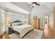 Spacious main bedroom with vaulted ceilings, a ceiling fan, hardwood floors, and natural light creating a relaxing sanctuary at 1228 Dunwoody Walk, Atlanta, GA 30338