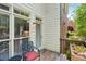 Cozy patio with seating and a view of the well-maintained exterior at 1228 Dunwoody Walk, Atlanta, GA 30338