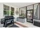 An outdoor screened porch featuring an outdoor kitchen, grill, and a screened in patio at 1228 Dunwoody Walk, Atlanta, GA 30338