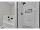 Bathroom showcases a soaking tub, glass shower, and marble tile at 217 Lamb Rd, Moreland, GA 30259