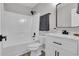 Bathroom featuring white tiled shower and white vanity at 217 Lamb Rd, Moreland, GA 30259