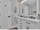 Bathroom features double vanity, marble countertops, and modern black fixtures at 217 Lamb Rd, Moreland, GA 30259