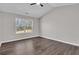 Bright bedroom with a vaulted ceiling and large window at 217 Lamb Rd, Moreland, GA 30259