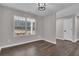 Bedroom featuring a vaulted ceiling and a large window at 217 Lamb Rd, Moreland, GA 30259