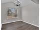 Bright dining room featuring a vaulted ceiling and a large window at 217 Lamb Rd, Moreland, GA 30259