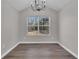Dining room featuring a vaulted ceiling and large window at 217 Lamb Rd, Moreland, GA 30259