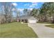 Charming single-story home with manicured lawn and attached garage at 217 Lamb Rd, Moreland, GA 30259