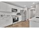 Modern kitchen with white cabinets, stainless steel appliances, and stylish countertops at 217 Lamb Rd, Moreland, GA 30259