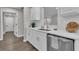 Beautiful kitchen with white cabinets, stainless steel appliances, and modern fixtures at 217 Lamb Rd, Moreland, GA 30259