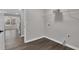 A utility room with wood-look floors, white trim, and a wire rack at 217 Lamb Rd, Moreland, GA 30259