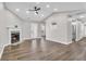 Bright living room features hard flooring, a fireplace, and a view into the kitchen at 217 Lamb Rd, Moreland, GA 30259