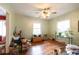 Open living room with hardwood flooring, plenty of natural light, and ceiling fan at 2383 N Decatur Rd, Decatur, GA 30033