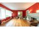 Spacious living room with hardwood floors, red walls, and large windows, offering a bright and inviting atmosphere at 2383 N Decatur Rd, Decatur, GA 30033