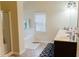 Bright bathroom featuring a shower and bath combo with a wide vanity and large mirror at 3830 Kittery Pt, Snellville, GA 30039