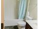 Simple bathroom featuring a shower-tub combo, toilet, and a small vanity with a sink at 3830 Kittery Pt, Snellville, GA 30039