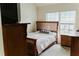 A cozy bedroom is furnished with a wooden bed frame, complementing nightstands, and soft, neutral carpet at 3830 Kittery Pt, Snellville, GA 30039