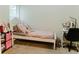Bright bedroom with a white bed frame, complemented by a functional desk setup and soft, neutral carpet at 3830 Kittery Pt, Snellville, GA 30039