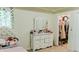 Charming bedroom featuring a white dresser and a walk-in closet, perfect for ample storage at 3830 Kittery Pt, Snellville, GA 30039
