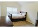 This bedroom features a comfortable bed, providing a relaxing space for rest and rejuvenation at 3830 Kittery Pt, Snellville, GA 30039