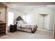Bedroom showcasing furniture and design with vaulted ceilings and two windows at 3830 Kittery Pt, Snellville, GA 30039