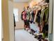 Walk-in closet features ample shelving and hanging space for optimal organization at 3830 Kittery Pt, Snellville, GA 30039