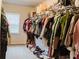 Walk-in closet features ample shelving and hanging space for optimal organization at 3830 Kittery Pt, Snellville, GA 30039