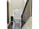 Bright entryway features hardwood floors, a high ceiling, and classic trim and a white front door at 3830 Kittery Pt, Snellville, GA 30039