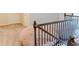 Upstairs hallway with a view of a decorative chair and a wooden railing at 3830 Kittery Pt, Snellville, GA 30039