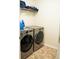 Modern laundry room equipped with sleek, front-loading washer and dryer units for convenient laundry care at 3830 Kittery Pt, Snellville, GA 30039