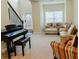 Spacious living room with neutral carpet, a comfortable seating area, and a staircase at 3830 Kittery Pt, Snellville, GA 30039