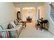 Open concept living and dining area, with ample natural light and neutral décor at 3830 Kittery Pt, Snellville, GA 30039