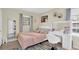 Cozy bedroom with a white vanity and a comfortable bed at 699 Rollingwood Dr, Stone Mountain, GA 30087