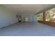 Spacious carport with blue trim and ample room for storage or parking at 699 Rollingwood Dr, Stone Mountain, GA 30087