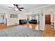 Open-concept living room boasts gleaming hardwood floors and neutral paint at 699 Rollingwood Dr, Stone Mountain, GA 30087