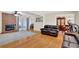 Bright living room features a brick fireplace, hardwood floors, and dining area at 699 Rollingwood Dr, Stone Mountain, GA 30087