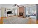 Bright living room with a brick fireplace, built in shelving, and sliding glass doors at 699 Rollingwood Dr, Stone Mountain, GA 30087