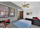 Cozy sun room with large windows, ceiling fan, and comfortable seating area with a view to the back yard at 699 Rollingwood Dr, Stone Mountain, GA 30087