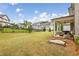 Large backyard featuring a cozy covered patio, comfortable seating, and a sandbox at 10265 Grandview Sq, Johns Creek, GA 30097