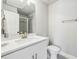 Bright bathroom with a white vanity, sleek hardware, quartz countertop, and a glass-enclosed shower at 10265 Grandview Sq, Johns Creek, GA 30097
