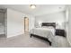 Comfortable bedroom with soft carpet, a dark wood bed frame, and bedside tables with lamps at 10265 Grandview Sq, Johns Creek, GA 30097
