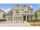 Charming two-story home featuring a three-car garage and a beautifully landscaped front yard at 10265 Grandview Sq, Johns Creek, GA 30097
