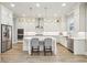 Modern kitchen with white cabinets, stainless steel appliances, and a spacious island at 10265 Grandview Sq, Johns Creek, GA 30097
