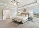 Bright main bedroom boasts tray ceilings and large windows for ample natural light at 10265 Grandview Sq, Johns Creek, GA 30097