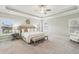 Spacious main bedroom features a tray ceiling, carpeted floor, and three large windows at 10265 Grandview Sq, Johns Creek, GA 30097