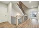 Bright foyer features a wood staircase with white risers and black iron balusters at 10265 Grandview Sq, Johns Creek, GA 30097